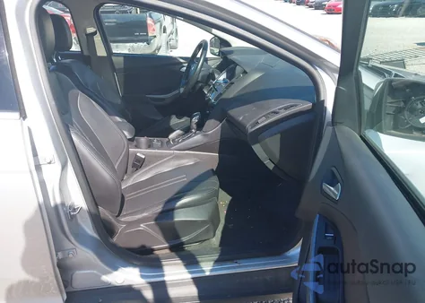 2012 Ford Focus Titanium z USA, uszkodzony, nr VIN 1FAHP3J21CL327807